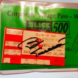 Bill Elliot Autographed 1994 Slick 50 500 admission ticket with a pit pass